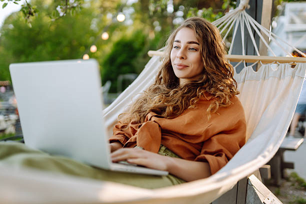Remote freelancer working outdoors on a laptop